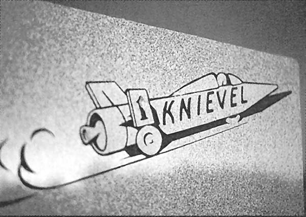 Logo of a rocket car with Knievel written on the side.