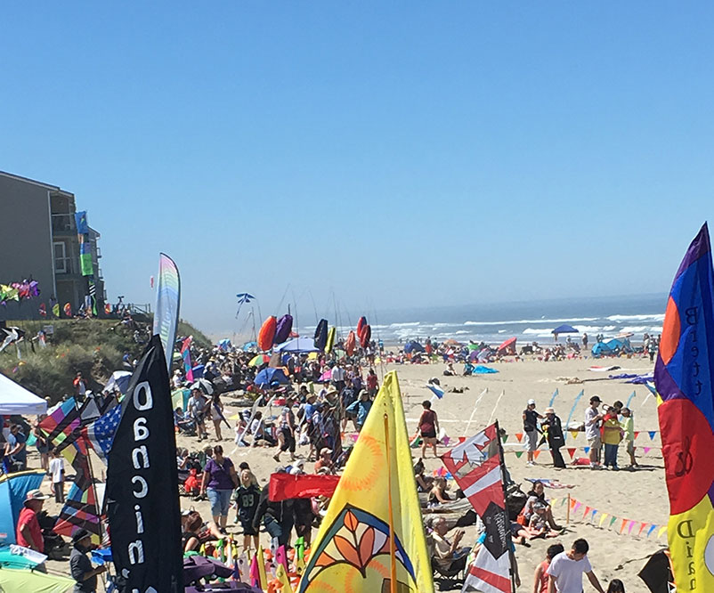 Festival crowd on the beach in June for Lincoln City's Kite Festival.