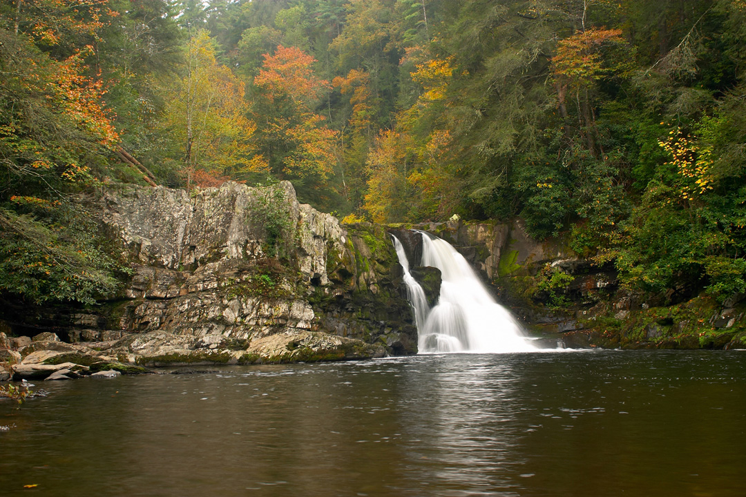 Photo of Abrams Falls with a small waterfall and fall foliage
