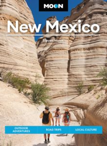 Cover of Moon New Mexico guidebook featuring image of hikers among towering white rock walls