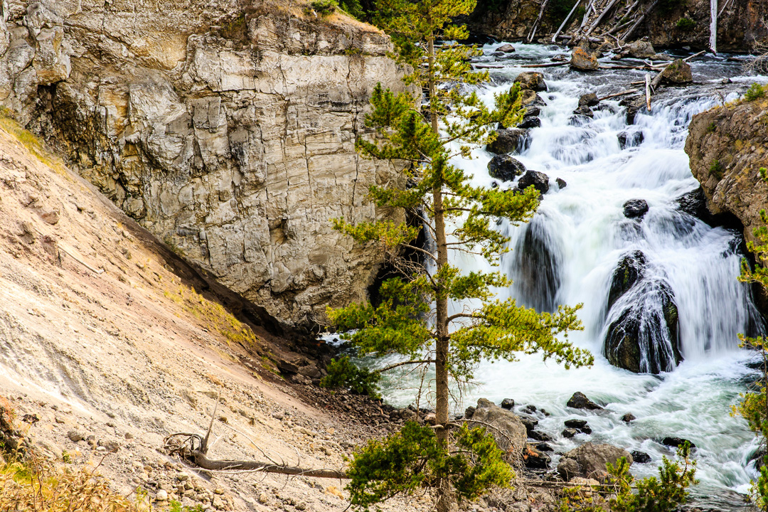 Firehole Falls with clear water running down rocks