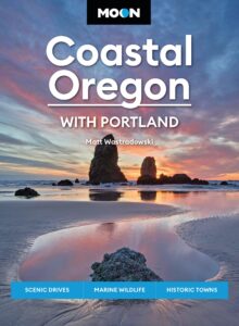 Moon Coastal Oregon book jacket featuring an image of sunset reflected on beach