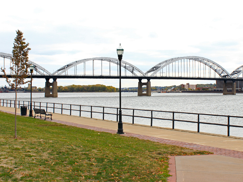 bridge over mississippi river as seen from a riverfront park