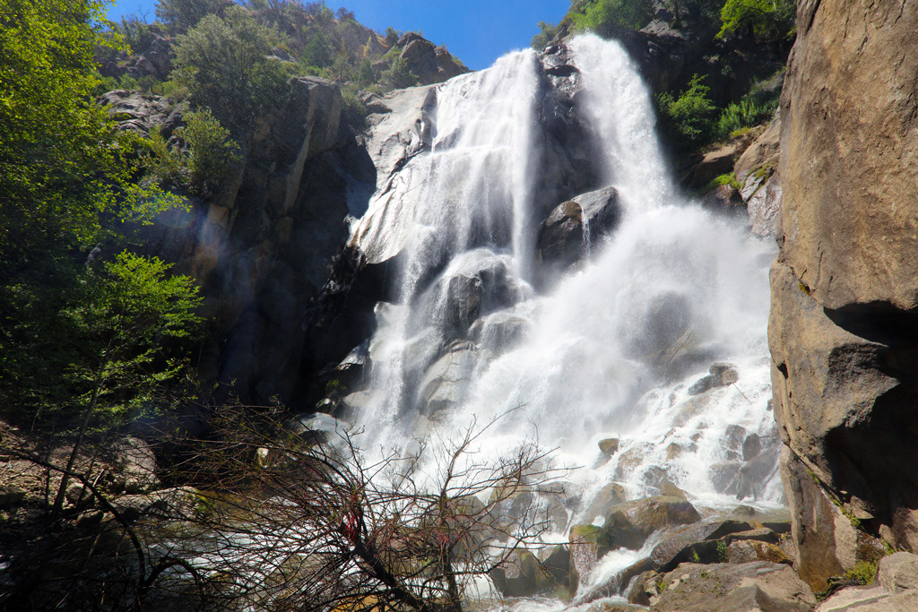 view from below a gushing waterfall