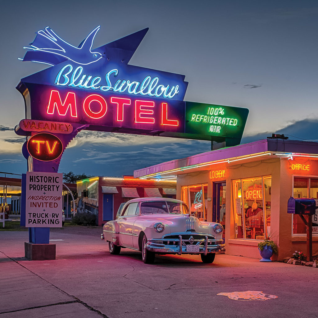 neon signs alight at the blue swallow motel in tucumcari