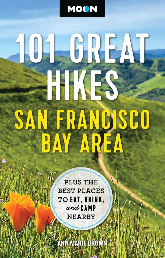 Book cover featuring image of orange poppies on green hills with text 101 Great Hikes San Francisco Bay Area