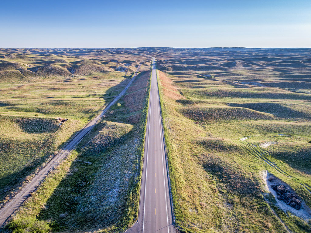 highway and frontage road running through sand hills of nebraska