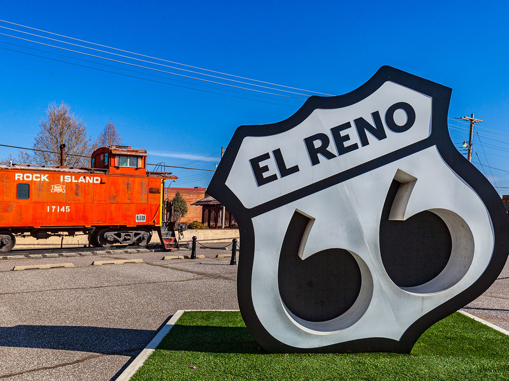 large el reno route 66 sculpture next to an old train car