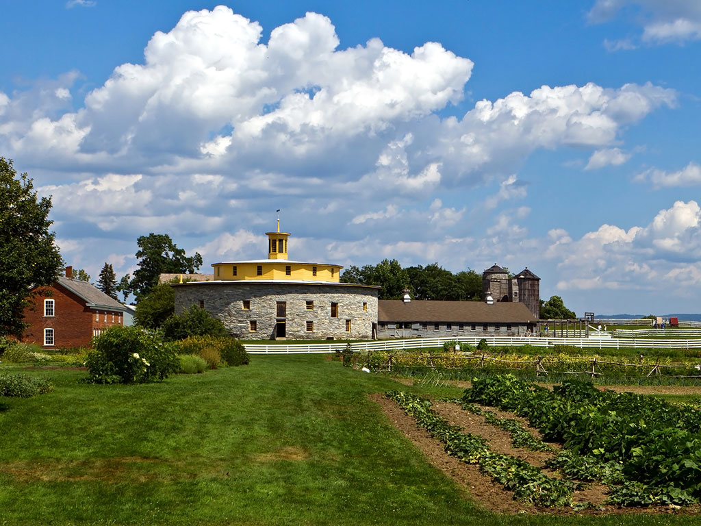 farmland surrounding a round building