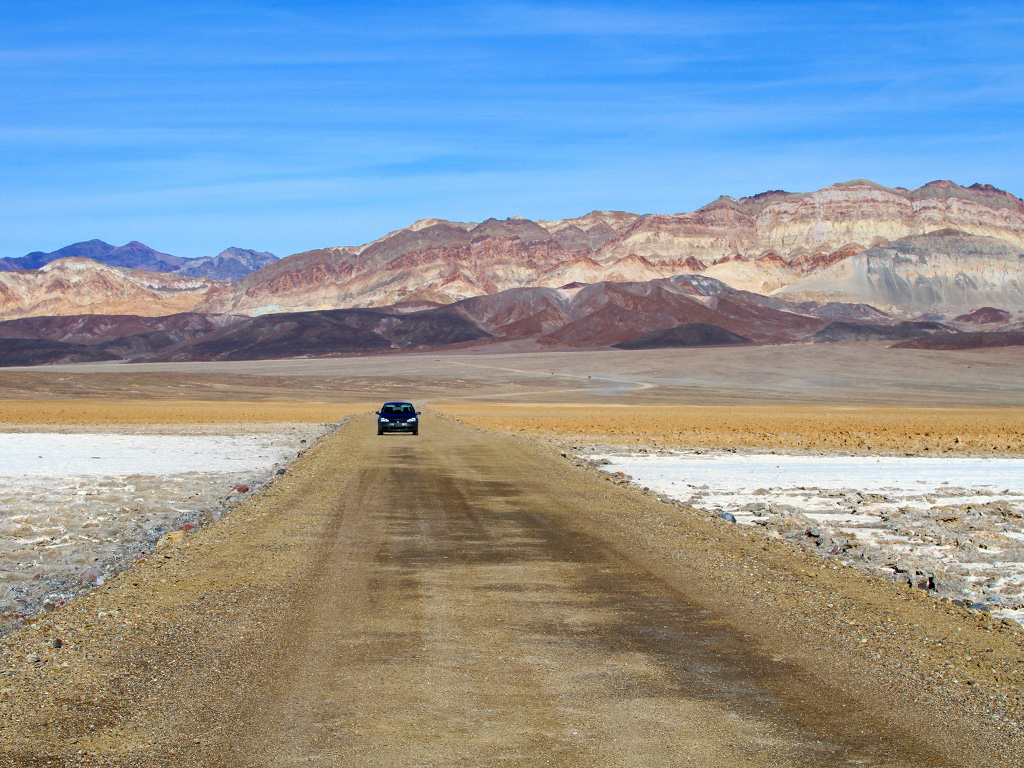 car on a dirt road in death valley