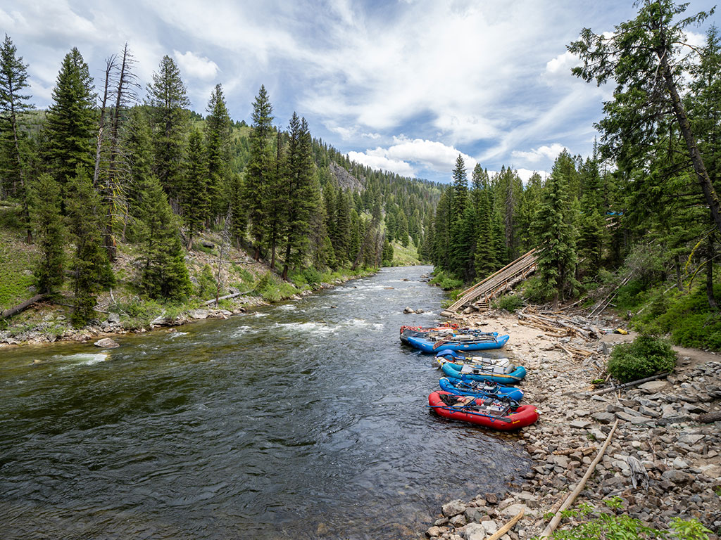 rafts sitting on the shore of the salmon river in idaho