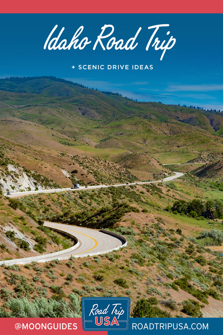road curving through mountains with overlaid text reading idaho road trip and scenic drives