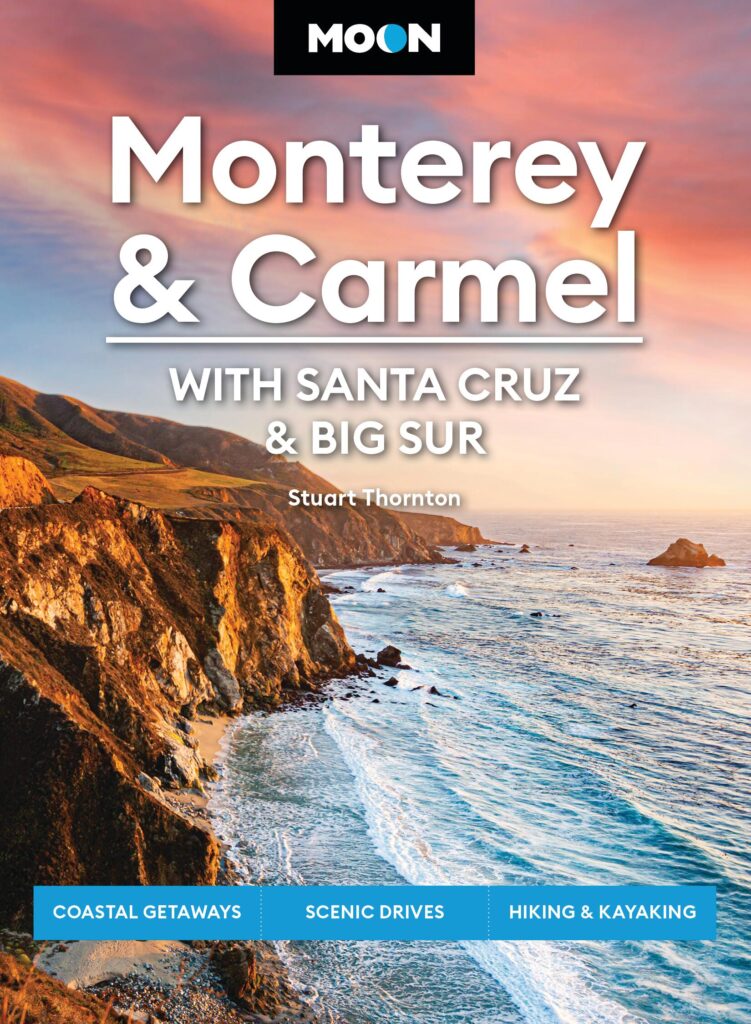 Book jacket featuring image of ocean coastline under pink sunset with text Monterey & Carmel